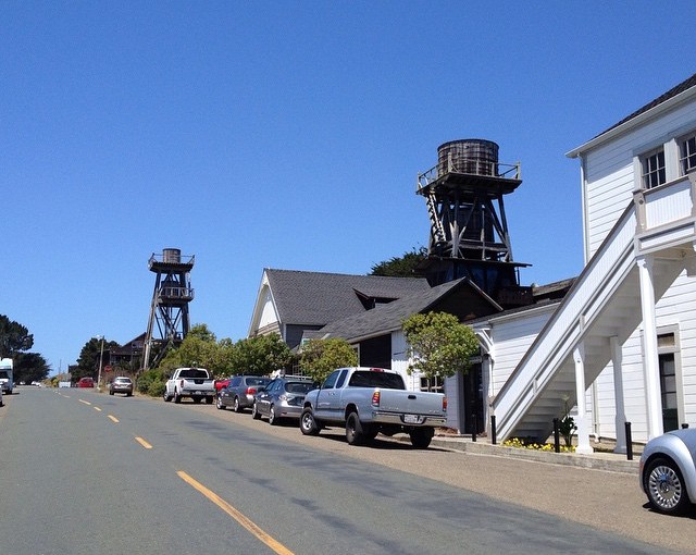 These are water towers that once provided for local residences. Many have converted them to tall houses, galleries or apartments.